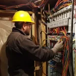 Electrician inspecting wiring. Safe fixes are important for aluminum wiring in Vancouver homes.